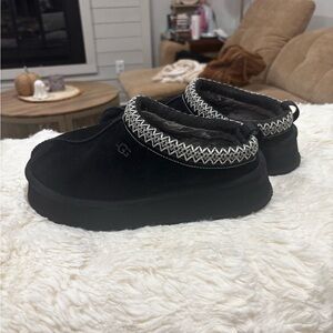 UGG Black Suede Slip-Ons with White Stitching